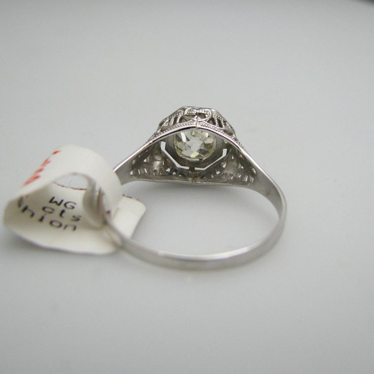 "For sale: (1) g009 Pretty 14k White Gold Diamond Old Mine Cut Engagement Ring PLEASE READ ENTIRE DESCRIPTION BEFORE PURCHASING Pre-owned item. Good condition. Please see pictures for details. Sold as is, as seen on pictures. This ring contains one diamond (round cut). It is stamped. Specifics: 14k White gold Diamonds: 0.85CT/TCW Size: 7.5 (U.S.) Width: 9 mm Total Weight: 1.7 grams Please be 100% sure of your purchase before buying, as we do not offer refunds. We are more than happy to provide a Fine Jewelry With Prong Setting For Formal Occasions, Formal Fine Jewelry With Prong Setting, 14k Gold Art Deco Jewelry, Classic Formal Jewelry With Diamond Cut, Platinum Collectible Diamond Ring, Art Deco 14k Gold Jewelry With Center Stone, Platinum Diamond Ring With Diamond Cut For Collectibles, White 14k Gold Art Deco Jewelry, Classic 14k White Gold Jewelry With Round Stone