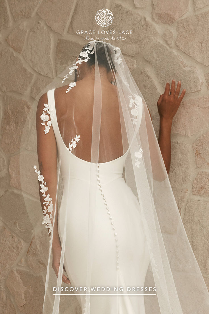 the back of a woman wearing a wedding veil