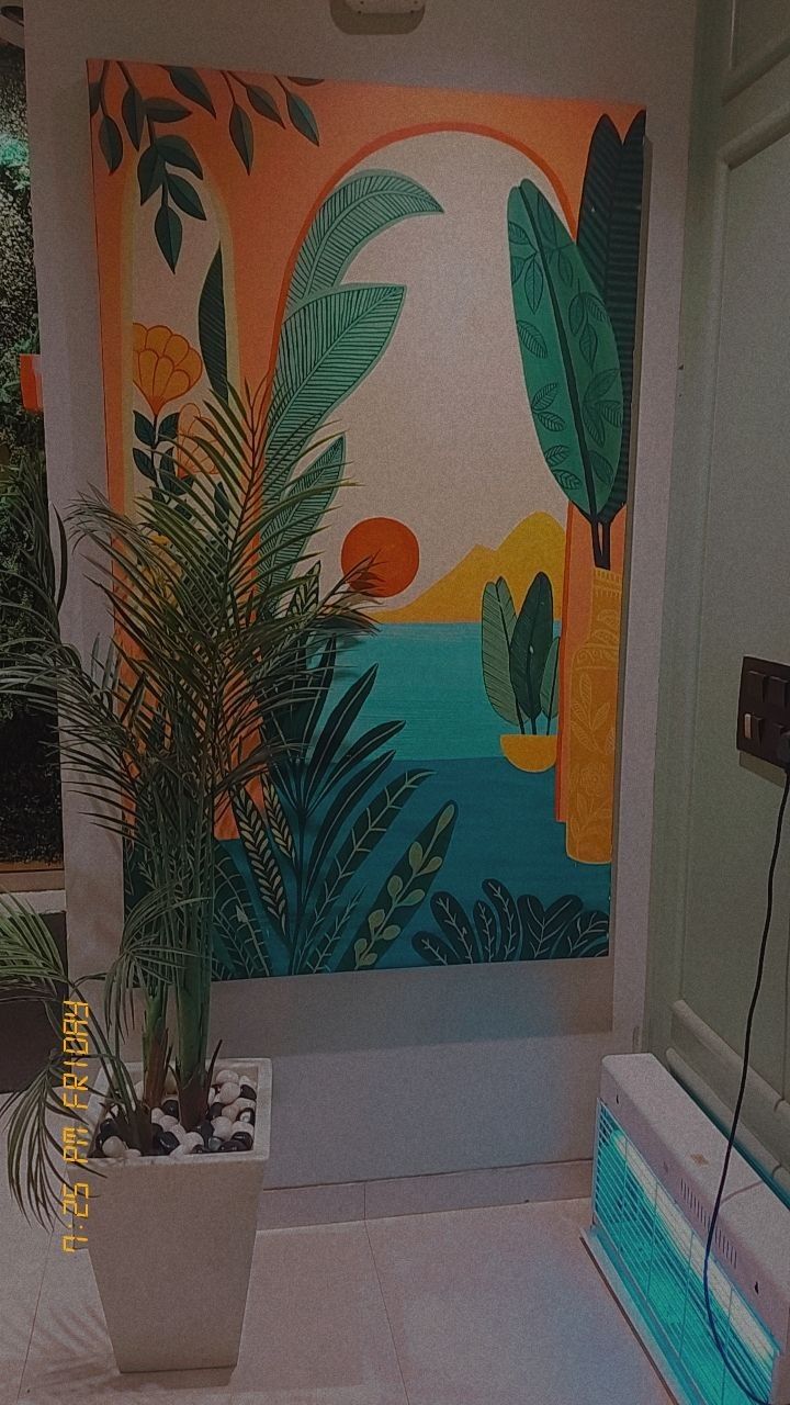 a bathroom with a painting on the wall next to a potted plant and toilet