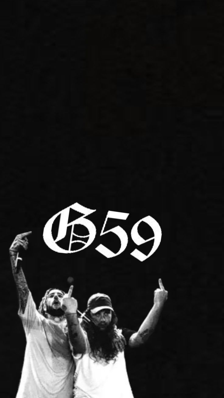 two people standing next to each other in front of a black background with the number 559 written on it