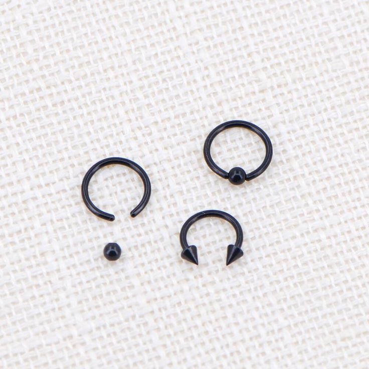 Descriptions: Safe Material: The hoop barbell is made of 316L stainless steel, nickel-free, lead-free, and hypoallergenic. Fine Craftsmanship: High polished smooth surface, comfortable for wearing without sharp edge, and no irritation to your skin. Multiple Usage: Can be used as cartilage earrings, helix earring, daith earring, conch earring, nose ring, and a septum ring. Common Size: Circular barbell thickness: 16G/1.2mm, Inner diameter: 8mm. Please choose carefully according to your piercing s Black Septum Ring, Black Septum, Tragus Rings, Earrings Conch, Conch Earrings, Lobe Earrings, Daith Earring, Tragus Ring, Septum Rings