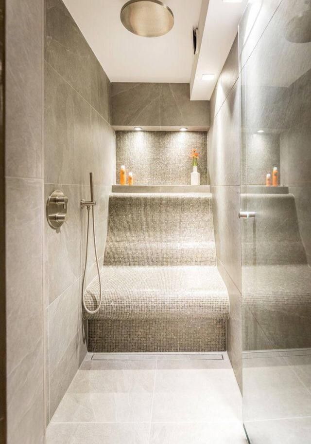 a bathroom with stairs leading up to the toilet