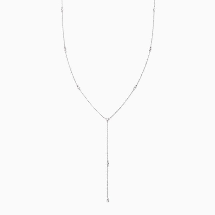 Add some shine to your look with our Icy Lariat Necklace. Coming in gold and silver, this Y-shaped necklace is the ultimate layering piece. Featuring a dainty chain and circular gemstones, this lariat necklace will layer perfectly with our Protection Necklace and Angel On Earth Pendant Necklace. Fine Jewelry Long Drop Necklace With Adjustable Chain, Elegant Silver Chain Lariat Necklace, White Gold Lariat Chain Necklace, Silver Chain Lariat Necklace, Delicate Chain Drop Necklace In White Gold, Elegant Lariat Necklace With Silver Chain, Delicate White Gold Lariat Necklace With Adjustable Chain, White Gold Drop Necklace With Delicate Chain, Fine Jewelry Lariat Drop Necklace With Adjustable Chain