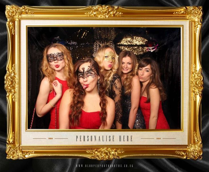 a group of women in red dresses posing for a photo with masks on their faces