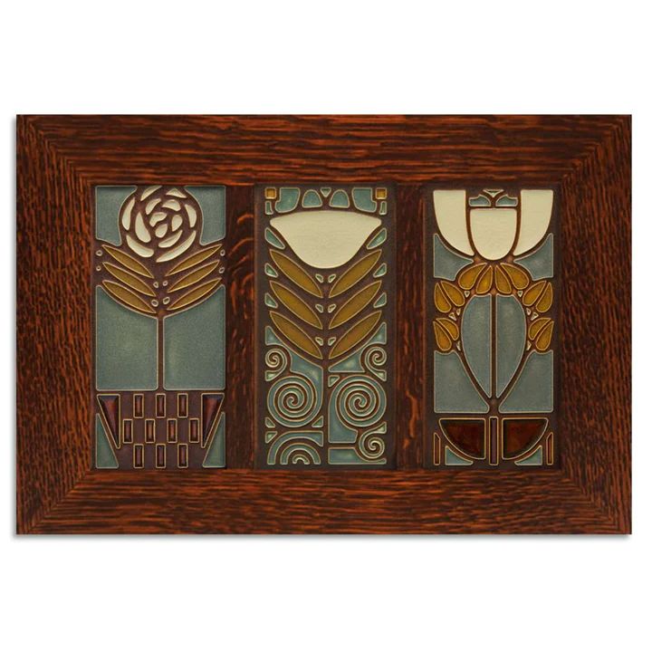 three stained glass panels with flowers and leaves in brown wood frame on white wall background