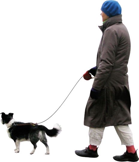 a woman walking her dog on a leash