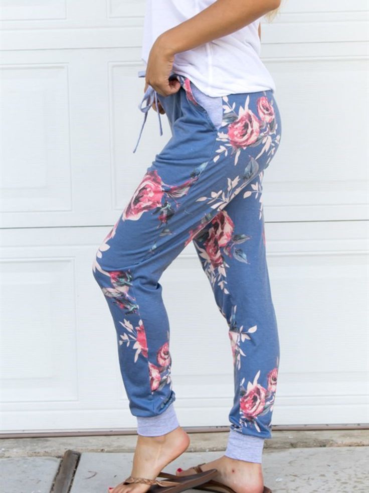 These comfy Floral Lounge pants are a MUST have! The drawstring waist and pockets are just some of the great features. Great for lounging around the house AND are cute enough to run errands. Sizing Small 0-4 Medium 6-8 Large 10-12 XL 12-14 Model is 5'6" wearing small Comfy Joggers With Elastic Waistband For Spring, Leisure Blue Joggers With Drawstring, Blue Drawstring Sweatpants For Leisure, Blue Joggers With Drawstring For Spring, Blue Spring Joggers With Drawstring, Comfy Bottoms With Relaxed Fit For Home Relaxation, Comfy Relaxed Fit Bottoms For Relaxing At Home, Comfy Relaxed Fit Bottoms For Home, Spring Joggers With Elastic Waistband For Lounging