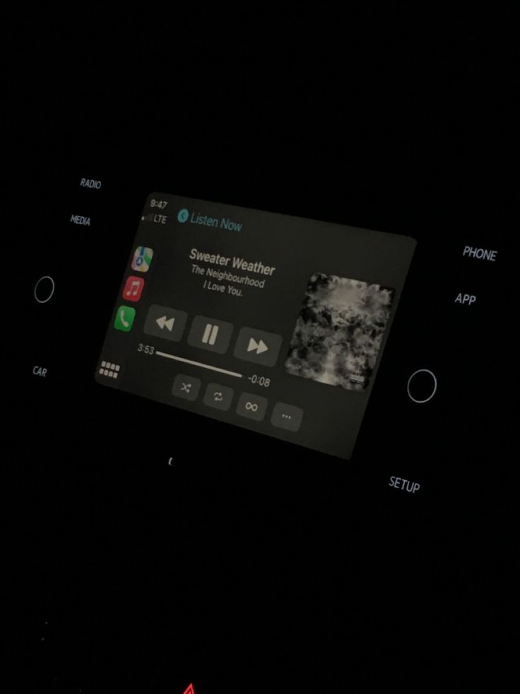 an app on the side of a cell phone in the dark with icons and buttons