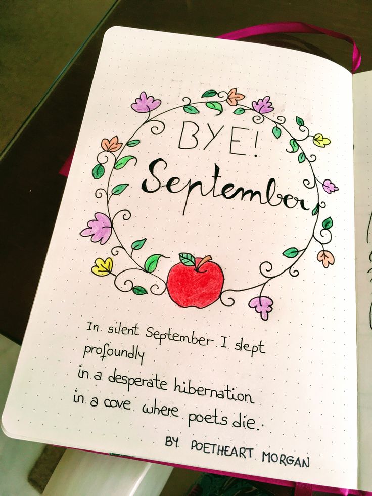 an open notebook with the words bye november written in black and red ink on it