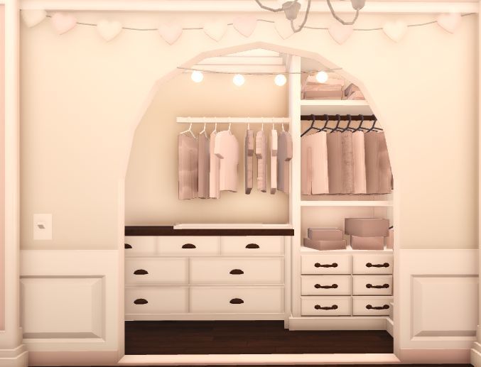 an open closet with white drawers and shelves