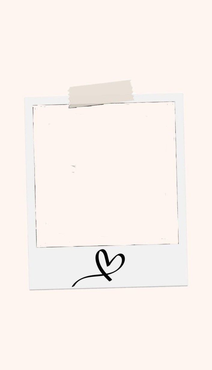 a white polaroid frame with a heart drawn on the side and a piece of paper stuck to it