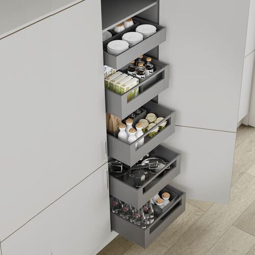 an organized kitchen drawer in the corner of a cabinet