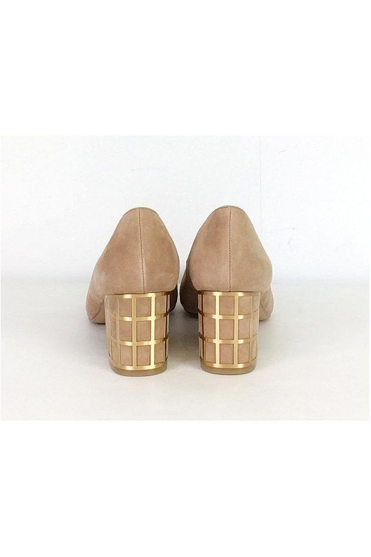 One-of-a-kind pumps in a tan suede. They feature a unique caged heel in a gold-tone metal. Pointed toe style adds a sleek touch. Size 7 M Leather upper Synthetic lining/sock Man made outsole Pointed toe No outsole wear Caged heel Heel height 2.5" Chic Gold Heels With Metal Feet, Modern Gold Low Heels, Spring Gold Heels, Modern Gold Low Heel Heels, Modern Gold Low Heel Shoes, Modern Gold Heels With Deep Heel Cup, Gold Heels With Deep Heel Cup In Modern Style, Chic Gold Court Shoes With Low Heel, Chic Gold Low Heel Court Shoes