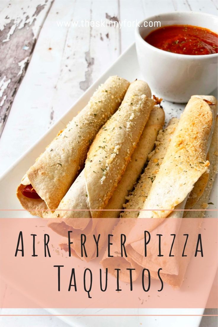 an appetizer plate with two burritos and a bowl of tomato sauce