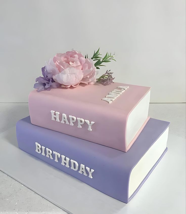 two books stacked on top of each other with the words happy birthday written on them