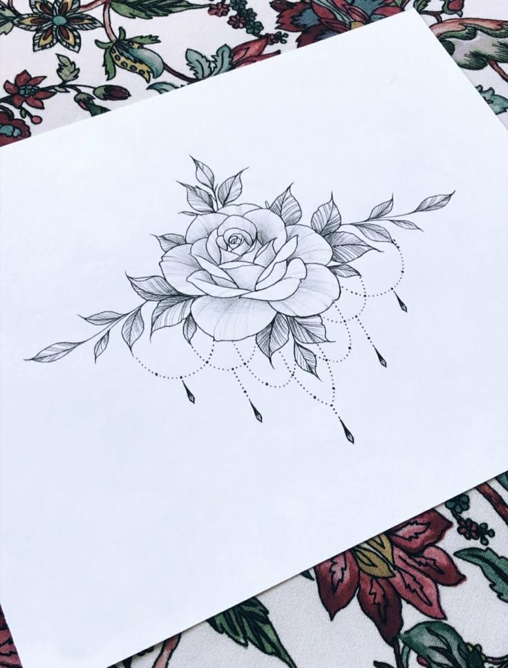 a drawing of a rose with leaves on it