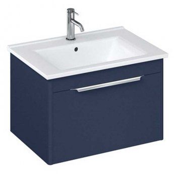 an image of a bathroom sink with blue cabinet and white counter top on the side