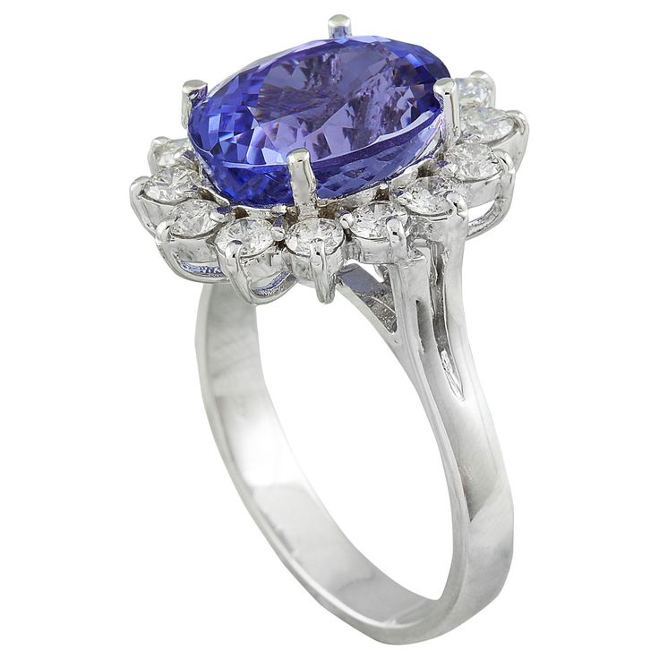 Stamped: 18K Total Ring Weight: 6.4 Grams Tanzanite Weight 7.30 Carat (13.45x10.30 Millimeters)Diamond Weight: 1.40 carat (F-G Color, VS2-SI1 Clarity )Face Measures: 19.15x16.10 Millimeter SKU: [600573] Luxury Oval Platinum Gemstones, Luxury Tanzanite Diamond Ring Gia Certified, Luxury Gia Certified Tanzanite Diamond Ring, Oval Tanzanite Diamond Ring In White Gold, Elegant Oval Gia Certified Gemstones, Oval Diamond Gemstones For Formal Occasions, Formal Oval Diamond Gemstones, Gia Certified Cluster Halo Ring For Formal Occasions, Formal Gia Certified Cluster Halo Ring