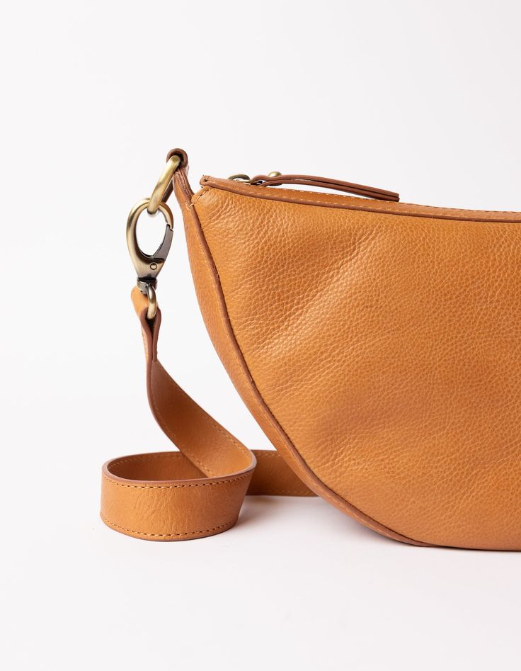 Say hello to Leo, the slouchy leather bag that fits all that you need for a busy day in town. Think of Leo as the cool sibling of our more structured Laura bag. Leo can be worn across the body as a bum bag, or on the shoulder as chic arm candy. Leo is unisex, catering to everyone who embraces that bumbag style. Leo comes in our wild oak soft grain leather, that timeless addition to any outfit. Do you want to wear Leo as a longer cross-body bag? Make sure to also add this strap to your cart. OMB-