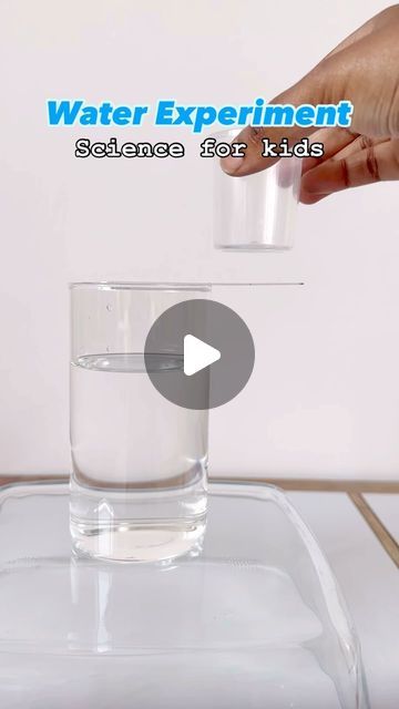 someone is pouring water into a glass on top of a table with the words water experiment science for kids