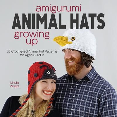 a man and woman standing next to each other in front of an animal hat advertisement