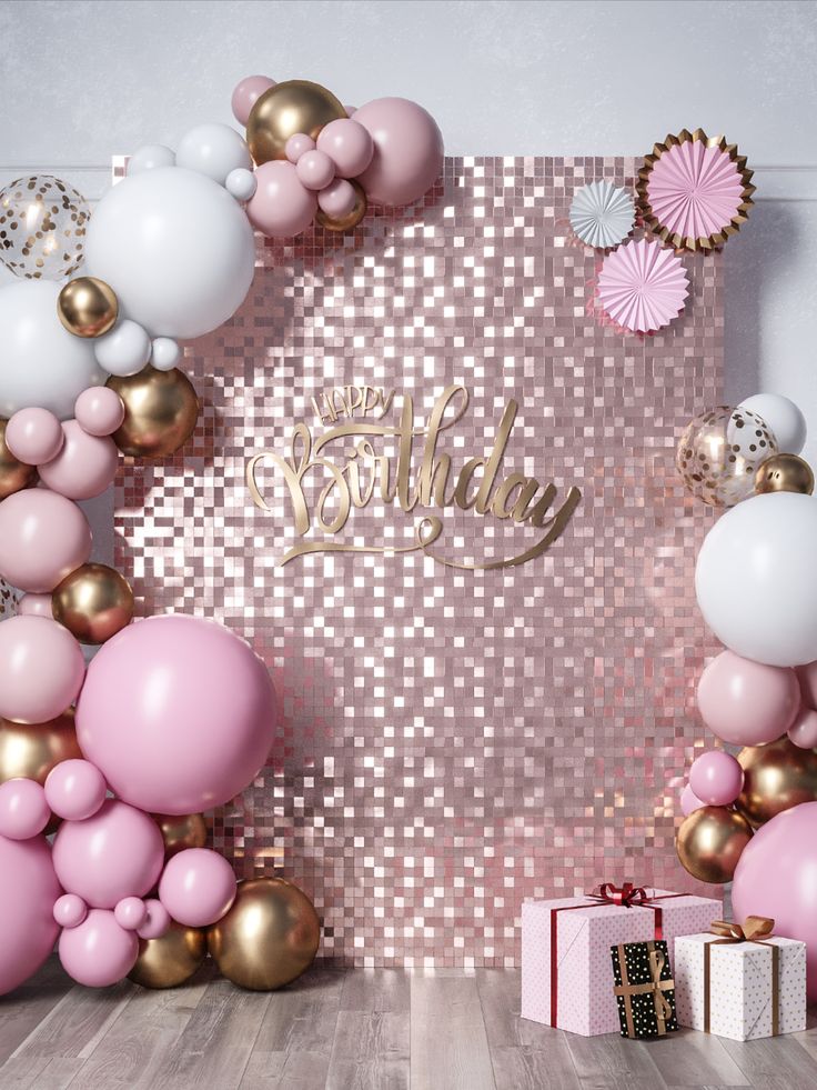 a pink and gold birthday party backdrop with balloons, confetti and streamers