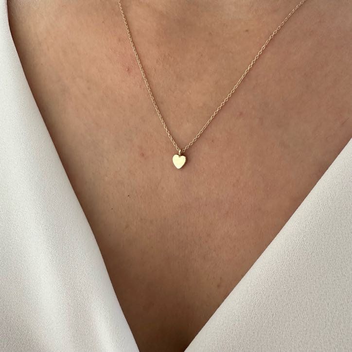 "14K Gold Heart Necklace, Minimalist Love Necklace, Wedding Gift The heart shape is universally recognized as a symbol of love and affection. Wearing heart jewelry can indicate a romantic relationship, deep emotional connection, or a loving sentiment toward someone as well as self-love and self-care. Heart jewelry, especially when given as a gift, can symbolize a commitment to a romantic partner or a pledge of loyalty and devotion. It might also represent the idea of giving one's heart to anothe Necklaces From Boyfriend, Heart Cut Necklace With Heart Charm For Wedding, Heart Cut Heart Charm Necklace For Wedding, Heart Pendant Necklace For Valentine's Day Wedding, Fine Jewelry Heart Pendant Necklace For Wedding, Fine Jewelry Double Heart Necklace For Wedding, Wedding Heart Pendant Necklace In Fine Jewelry Style, Minimalist Wedding Jewelry With Heart Charm, Wedding Fine Jewelry Heart Necklace With Charm