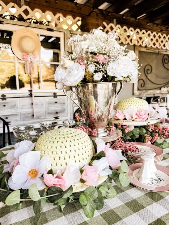 a table topped with plates covered in flowers