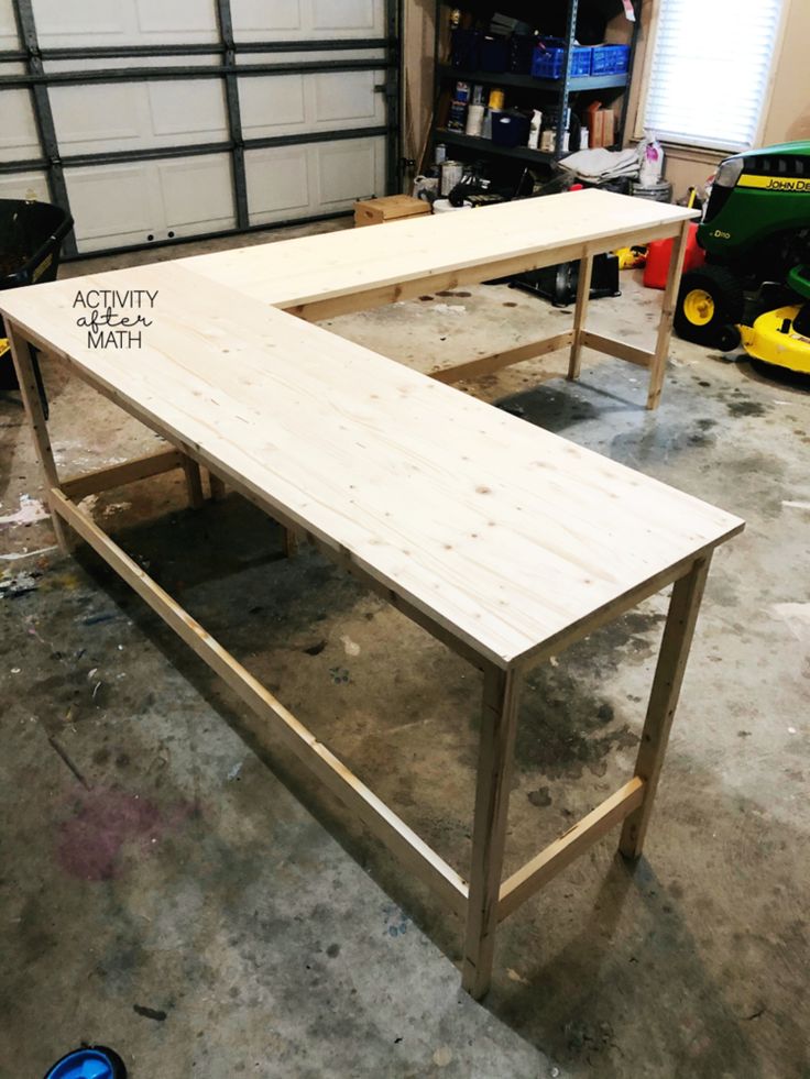 a wooden bench sitting inside of a garage