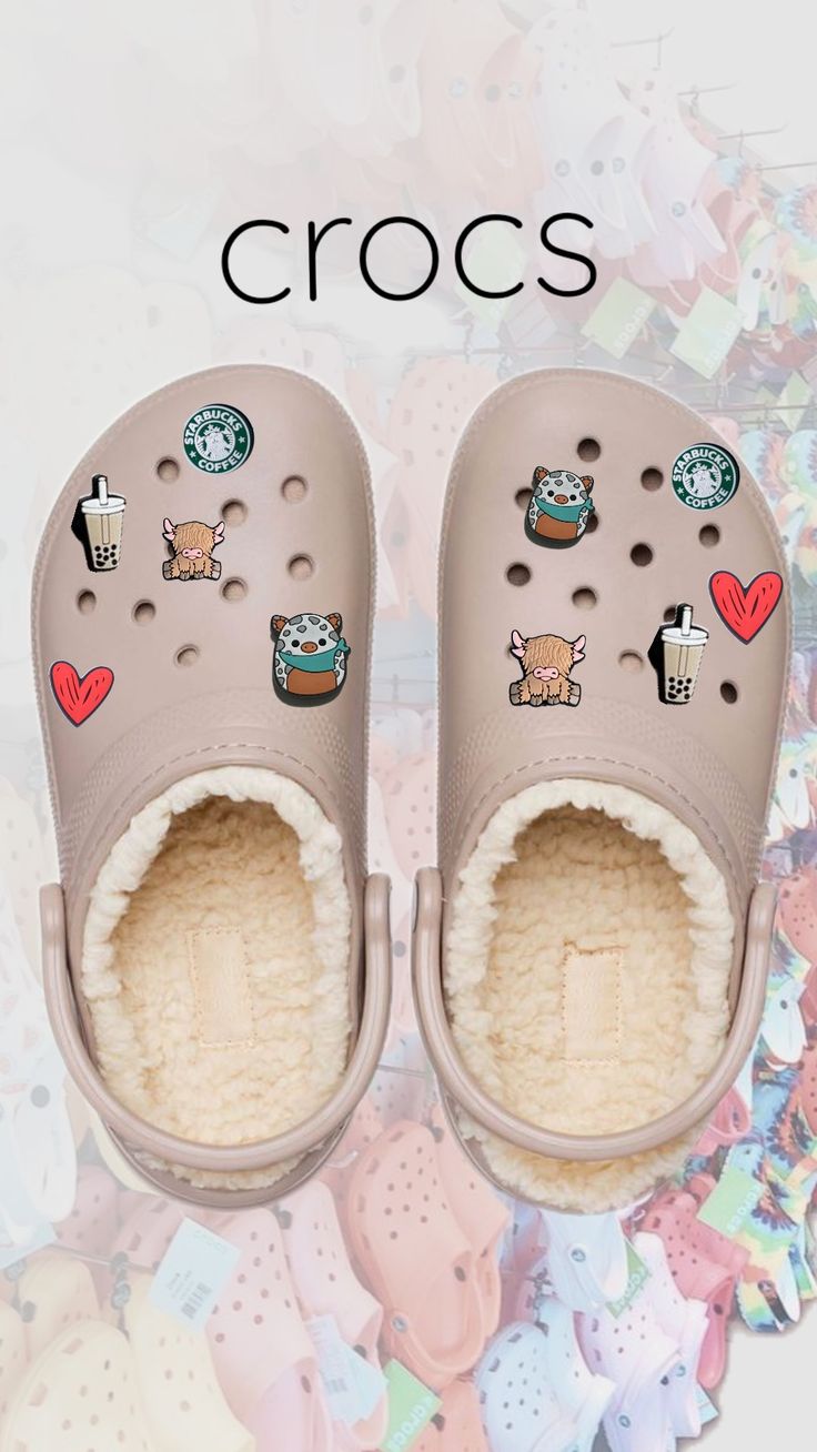 a pair of crocs with stickers on them