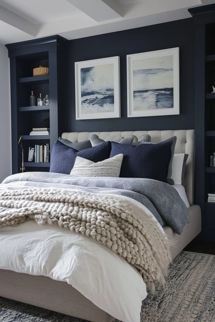 a bedroom with blue walls, white bedding and gray carpeted flooring is pictured in this image