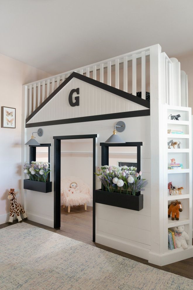 a child's bedroom with a loft bed and bunk beds on the bottom floor