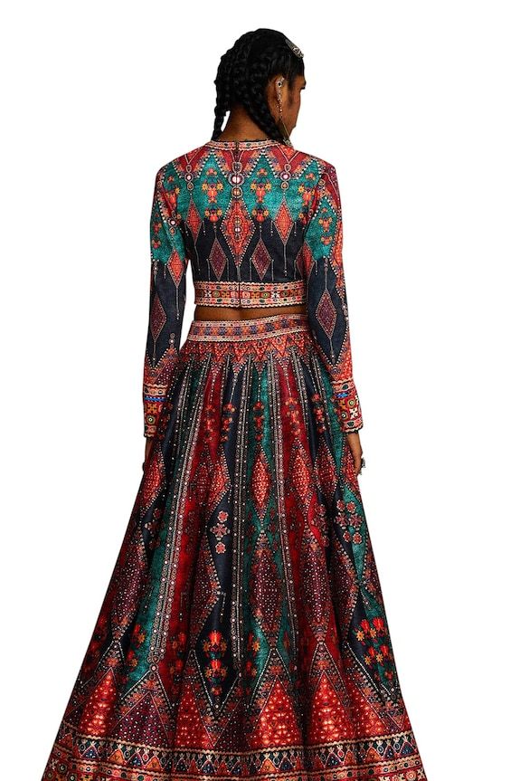 Multi color blouse with tribal print and threads, beads embroidery. Paired with coordinating lehenga and dupatta. - Aza Fashions Long Sleeve Dresses With Motifs For Navratri, Fitted Long Sleeve Sharara For Traditional Occasions, Fitted Long Sleeve Sharara For Traditional Ceremonies, Fitted Long Sleeve Choli For Traditional Ceremonies, Anarkali Lehenga With Multicolor Embroidery Motifs, Long Sleeve Choli With Pallu For Traditional Ceremonies, Traditional Drape Lehenga With Resham Embroidery For Festival, Bohemian Anarkali Set With Traditional Patterns, Lehenga With Resham Embroidery For Festival