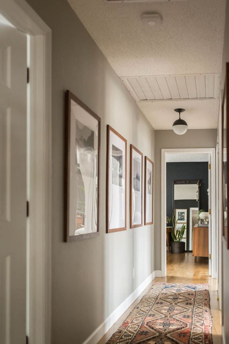 the hallway is clean and ready to be used as a place for pictures or photographs