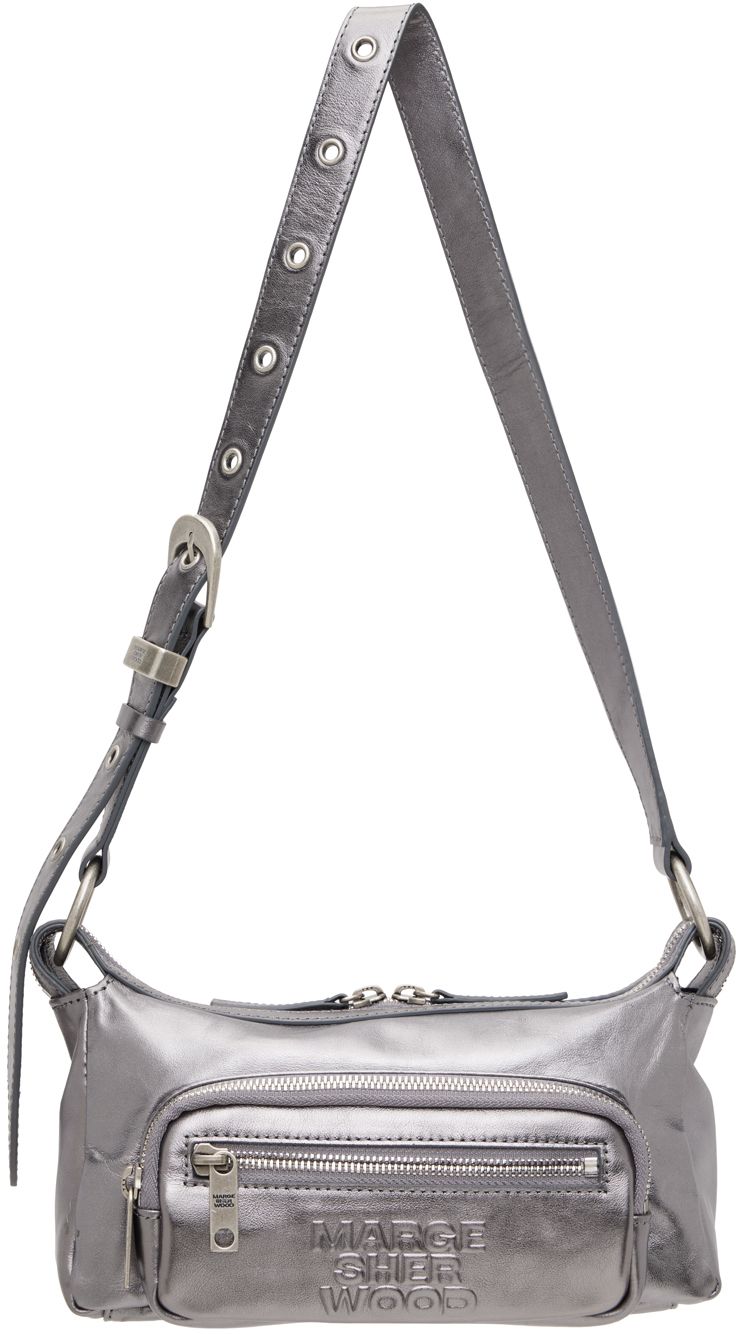 Grained leather shoulder bag in metallic silver tone. · Adjustable shoulder strap · Logo embossed at face · Zip pockets · Two-way zip closure · Zip pocket at interior · Card slot · Logo-woven twill lining · Logo-engraved antiqued silver-tone hardware · H5.75 x W9 x D3 Supplier color: Metallic grey foiled Everyday Silver Shoulder Bag With Zipper, Silver Leather Shoulder Bag With Adjustable Strap, Silver Leather Bag With Zipper Closure, Silver Leather Bags With Zipper Closure, Silver Shoulder Bag With Zipper For Travel, Modern Silver Shoulder Bag For Travel, Silver Shoulder Bag With Zipper Closure For Travel, Silver Shoulder Bag With Zipper For Everyday Use, Modern Metallic Silver Shoulder Bag With Silver-tone Hardware