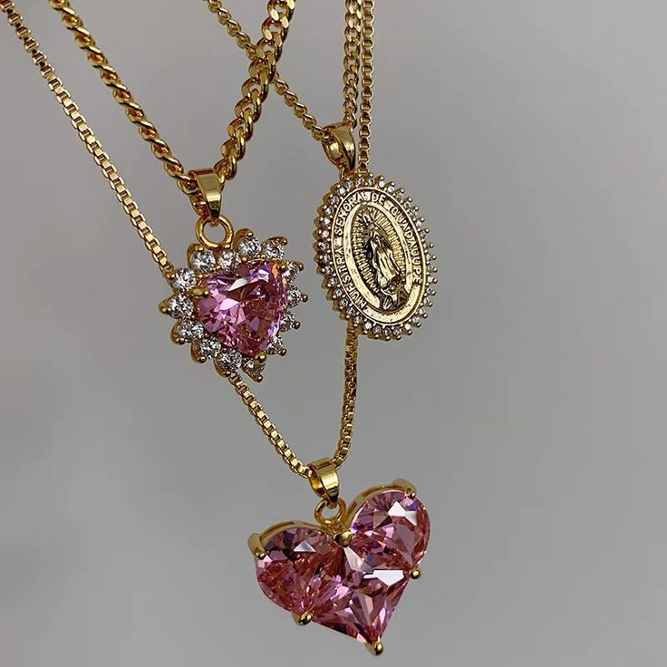 This necklace is the perfect mix of edgy and cute- a pink heart surrounded by crystal spikes Material: Gold-plated Copper, Cubic Zirconia Weight: 11.8g Size: 18 inches with a 3 inch adjustor Jewelry Accessories Ideas, Dope Jewelry, Girly Accessories, Jewelry Fashion Trends, Classy Jewelry, Expensive Jewelry, Fancy Jewellery, Pink Jewelry, Funky Jewelry