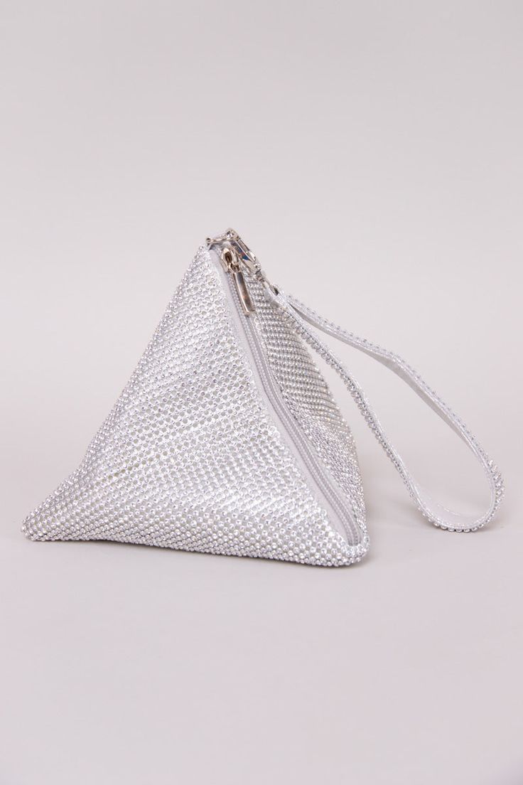 The perfect evening bag when you're feeling glamorous! The Rhinestone Triangle Bag is adorned in all-over rhinestones and features a chic ring handle bag design. Other details include a removable chain, snap button front closure, and silk interior. 8" x 6" x 6" Holds smaller items: lipstick, i.d., money, and keys. ﻿Compatible with small mobile phones. Colors may vary with different viewing devices. Silver Bling Bags For Night Out, Chic Silver Bags With Rhinestones, Chic Silver Crystal Evening Bag, Chic Rhinestone Pouch Evening Bag, Silver Rhinestone Pouch Bag, Silver Crystal Clutch Bag, Glamorous Bags With Silver-tone Hardware For Events, Silver Evening Bag With Bling For Night Out, Glamorous Silver Bag With Rhinestones