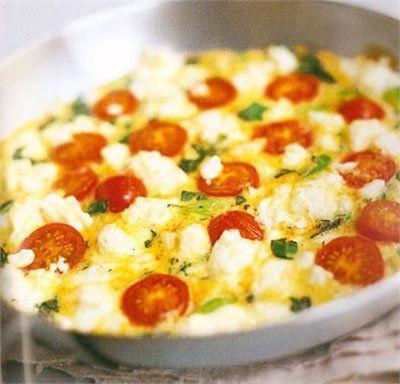 a pan filled with cheese and pepperoni on top of a table