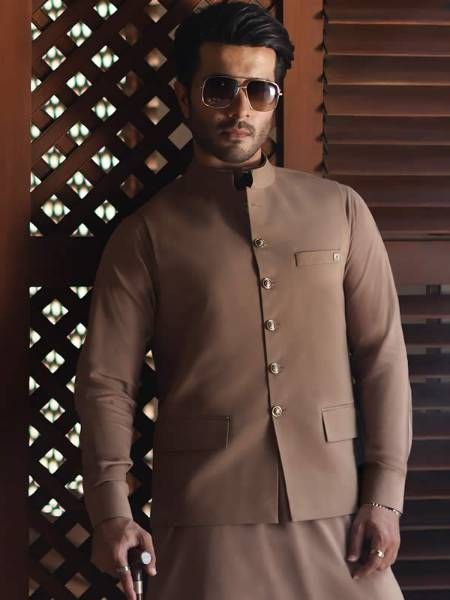 <p><strong>Waistcoat<br /></strong>Color: Tan<br />Fabric: PC Suiting Fabric<br />Smart looking designer waistcoat crafted in suiting fabric<br />Fanciful front button closure<br /><br /><strong>Inner:</strong><br />Comes with matching kurta and pajama<br /><br /><strong>Additional Accessories:<br /></strong>Peshawari Sandal / Khussa: <strong>US$30</strong></p> Winter Semi-formal Single-breasted Sets, Semi-formal Nehru Jacket With Long Sleeves, Semi-formal Long Sleeve Nehru Jacket With Buttons, Long Sleeve Nehru Jacket With Buttons For Semi-formal Occasions, Long Sleeve Tailored Nehru Jacket For Semi-formal Occasions, Tailored Long Sleeve Nehru Jacket For Semi-formal Occasions, Traditional Workwear Kurta With Buttons, Traditional Nehru Jacket With Stand Collar, Fitted Kurta With Stand Collar For Workwear