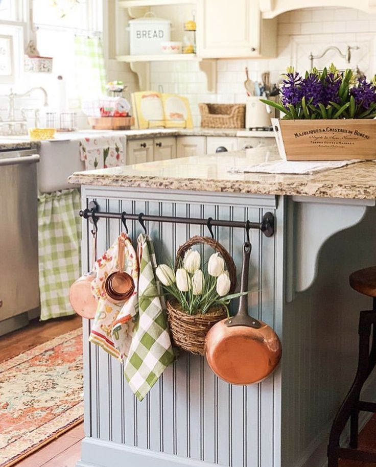 pots and pans are hanging on the kitchen island