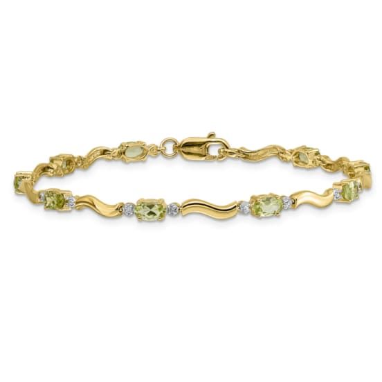 14k yellow gold and rhodium over 14k yellow gold fancy diamond and 2.250 cttw peridot bracelet. Measures approximately 1/8 of an inch in width and has a lobster claw closure. Yellow Gold Cubic Zirconia Jewelry With Accent Stones, Yellow Gold Peridot Gemstone Jewelry, Fine Jewelry Peridot For Formal Occasion, Formal Fine Jewelry With Peridot, Gold Multi-stone Diamond Bracelet, Gold Jewelry With Diamond Accents For May Birthstone, Elegant Peridot Jewelry For May Birthstone, Formal Peridot Jewelry For May Birthstone, Yellow Peridot Jewelry For May Birthstone