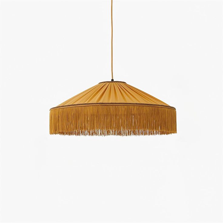 a light that is hanging from the ceiling with fringes on it's sides