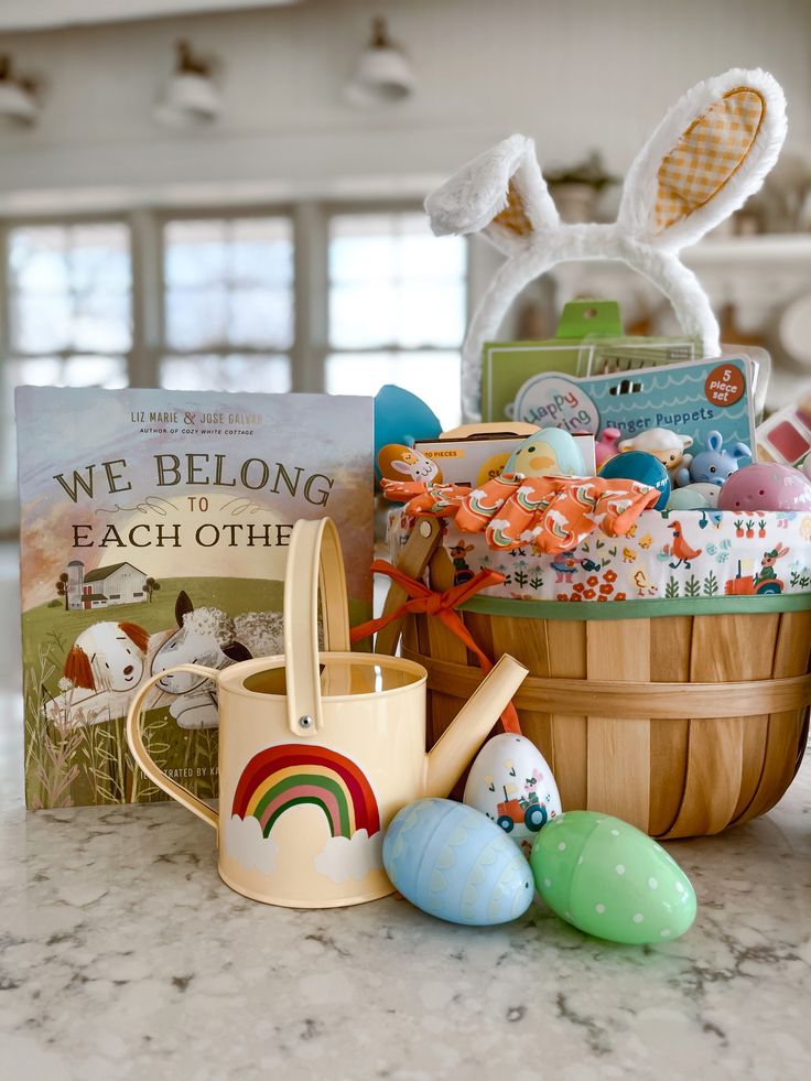 a basket filled with lots of different items next to an easter egg and bunny ears