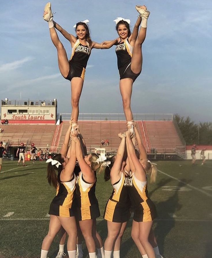 the cheerleaders are doing tricks on the field