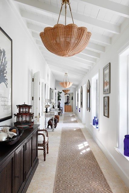 the hallway is clean and ready to be used as a dining room or living room