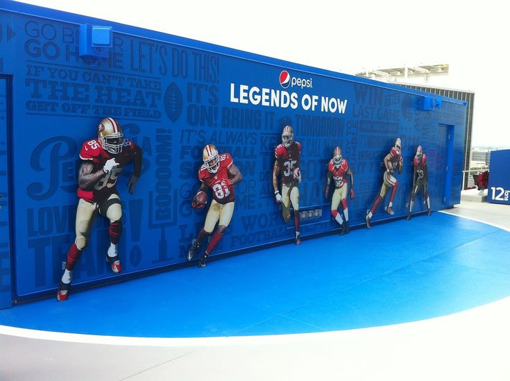 several football players are lined up in front of a blue wall with the words, legendds of now on it