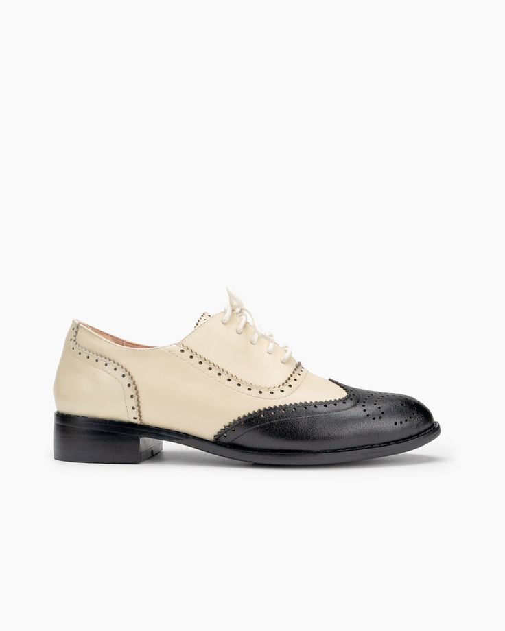 Elevate your footwear collection with the Lace Up Two Tone Flat Brogues Wingtip Oxford. Combining classic brogue details with a contemporary two-tone design, these shoes are perfect for anyone seeking to make a stylish statement while enjoying all-day comfort. Product Details h2 { text-align: center; margin-bottom: 20px; } .tab-container { display: flex; border-bottom: 2px solid #ddd; margin-bottom: 20px; } .tab { flex: 1; text-align: center; padding: 10px; cursor: pointer; font-weight: bold; bo Beige Wingtip Oxfords For Formal Occasions, Elegant Beige Oxfords With Round Toe, Vintage Lace-up Shoes With Flat Heel For Office, Classic Cap Toe Flats For Work, Vintage Flat Heel Oxford Lace-up Shoes, Vintage Flat Heel Oxfords For Office, Vintage Oxford Lace-up Shoes With Flat Heel, Beige Brogue Oxfords For Formal Occasions, Formal Beige Brogue Oxfords