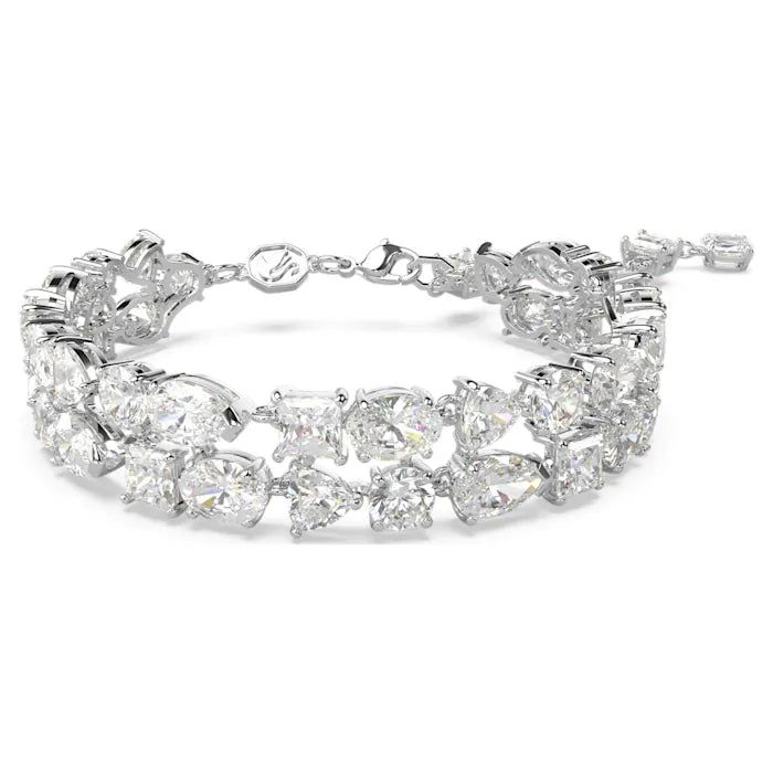 Make this extraordinary double-row bracelet one of the defining pieces of your jewelry collection. The rhodium plated design combines a radiant cluster of prong-set Swarovski Zirconia in a dramatic mix of cuts finished with a lobster closure. For added luxury, the hanging elongation features a string of Swarovski Zirconia. Pure elegance for your own evening style, or a wondrous gift for a loved one. Article no.: 5669927 Collection: Mesmera Color: White Length (minimum - maximum): 6.1 - 7.68 inch Evening Style, Swarovski Bracelet, White Bracelets, Holiday Earring, Swarovski Jewelry, Bracelets And Charms, Metal Color, Adjustable Bracelet, Crystal Bracelets