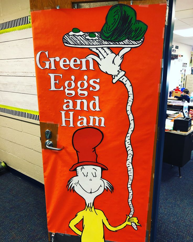 an orange door with the words green eggs and ham painted on it in front of a classroom