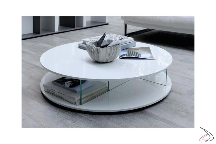 a white coffee table sitting on top of a hard wood floored living room area